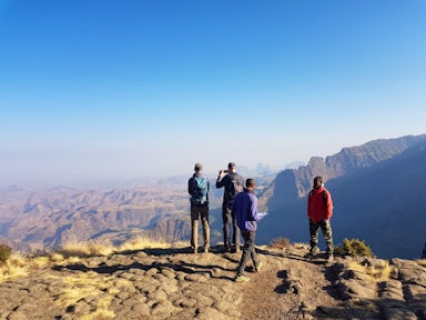 People looking at views in the Simien Mountains with blue skies